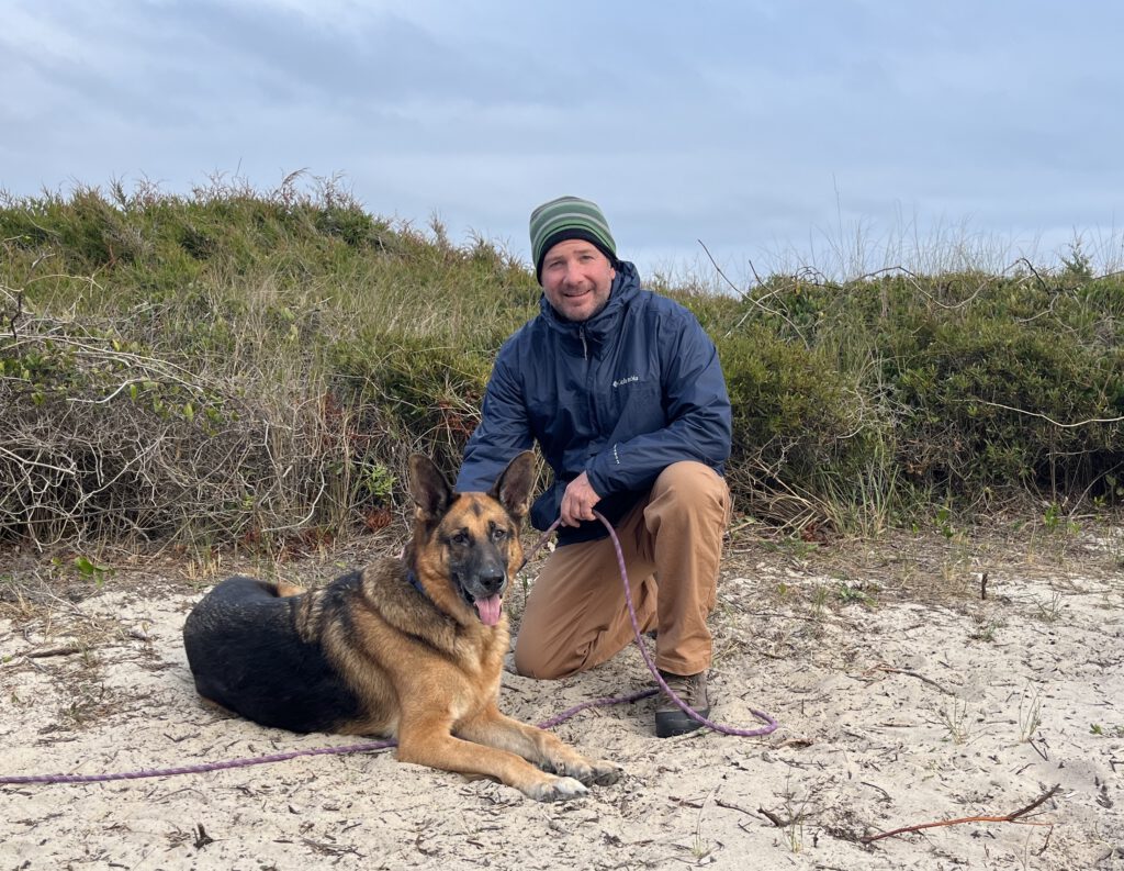 Nate with his senior German Shepherd, Zeus, at 10 years old.